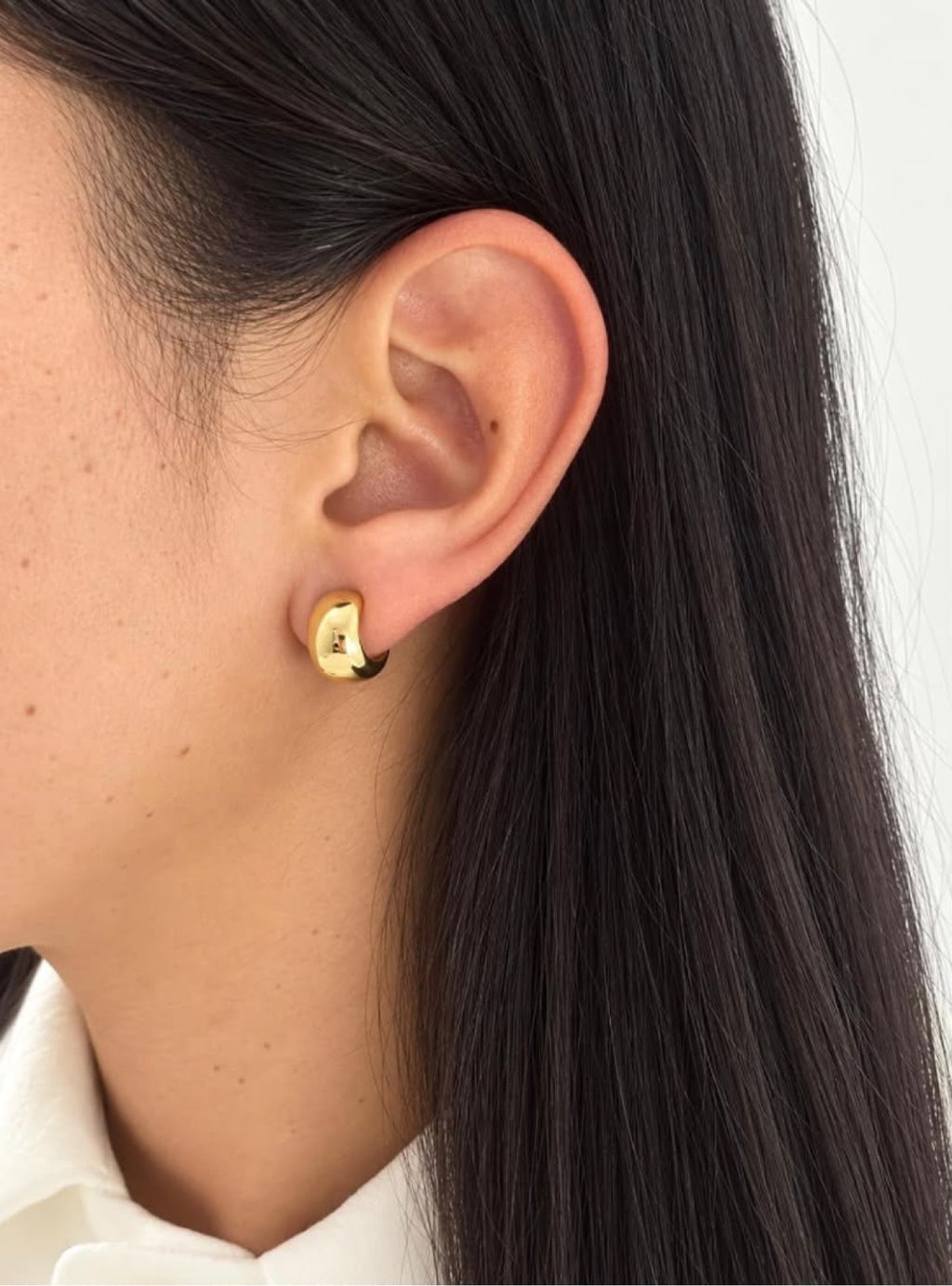 Lucia Crescent Hoops on ear, close view