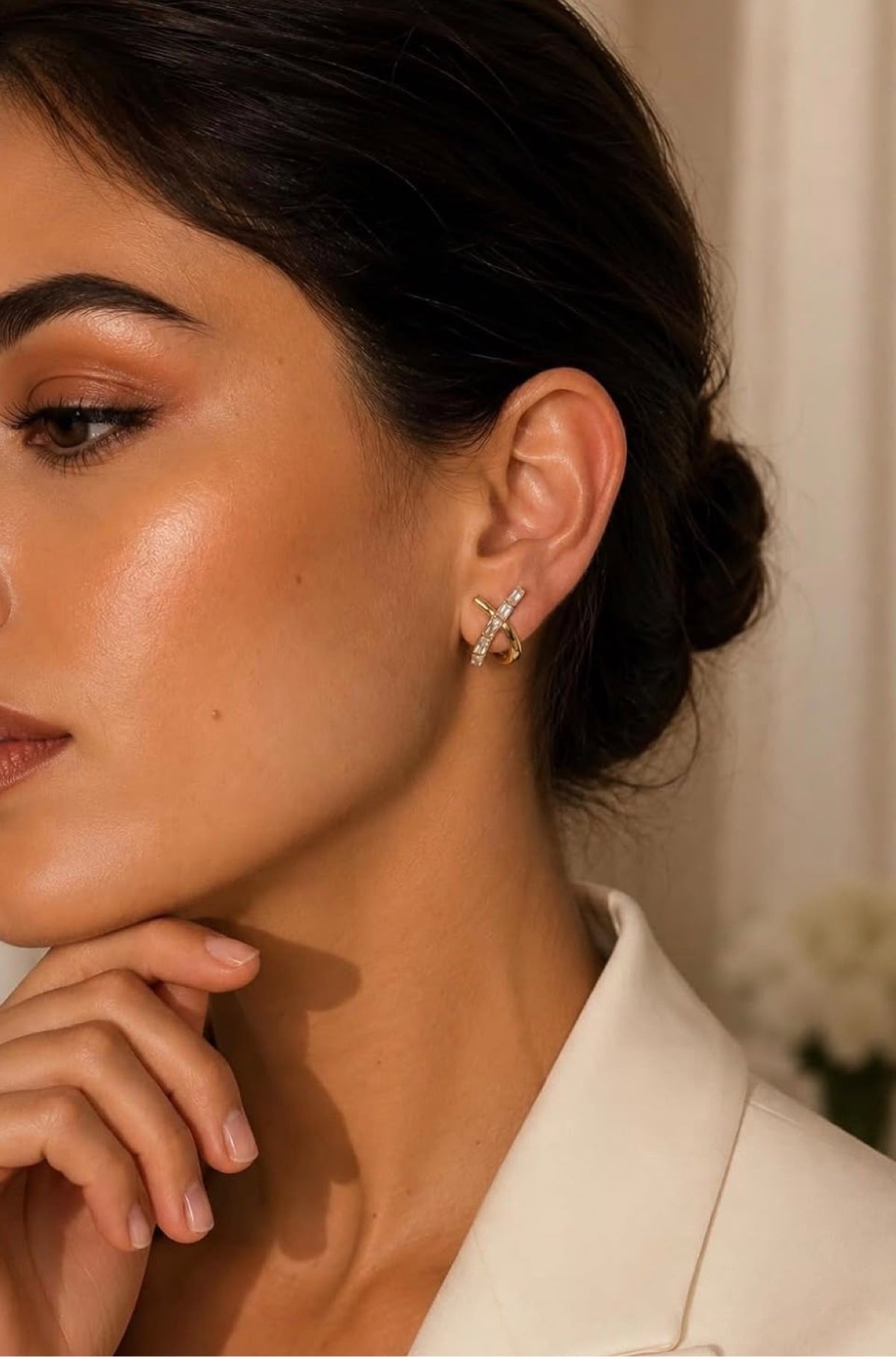 Model wearing Bianca Criss-Cross Studs, white top